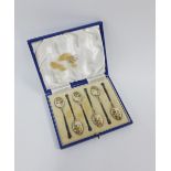 George VI set of six silver gilt and enamel teaspoons, the bowls with a mixed flower pattern,