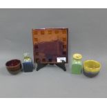 Margery Clinton lustre glazed pottery to include a square tile, two tea bowls and two small vases,