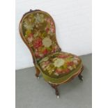 19th century mahogany framed nursing chair with tapestry upholstered back and seat, on ceramic