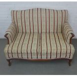 Two seater sofa of traditional form with red striped upholstery, on cabriole legs, 45 x 21 x 28cm