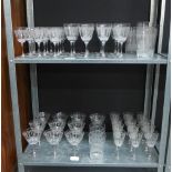Suite of Edwardian drinking glasses with etched floral garland pattern to include beakers, wine