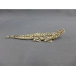 Early 20th century marine ivory model of a crocodile, 18cm long