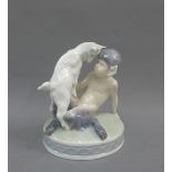 Royal Copenhagen figure of a faun riding on a goat, printed backstamp and model number 498, 13cm