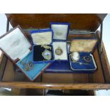 Early 20th century oak jewellery box containing gold and yellow metal brooches, 9ct fob medal,