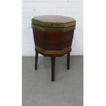 19th century mahogany and brass bound cellarette of octagonal shape, lead line, on a stand with four