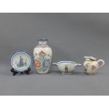 Collection of Quimper pottery to include a vase, bowl, small jug and a saucer (4)