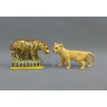 Beswick model of Lioness, with printed backstamp, 17cm long, together with a Staffordshire pottery