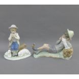 Lladro figure of a boy with a bird perched on his foot, 23cm long, and a Nao figure, (2)