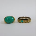 18ct gold ring with a green oval cabouchon in an engraved and scrolling gold band together with a