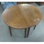 Pair of mahogany demi lune tables, (2)