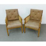 A pair of contemporary Bergere armchairs with loose taupe coloured buttonback leather cushions, 65 x