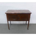 Mahogany washstand with a red marbled top, terminating on brass caps and castors, 92 x 69 x 46cm