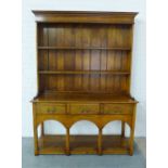 Reproduction oak Welsh dresser by Gwilym Price Son & Daughter, 137 x 190 x 46cm