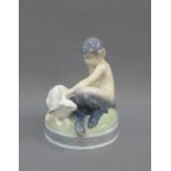 Royal Copenhagen figure of a faun with a hare, printed backstamp and model number 439, 13.5cm high