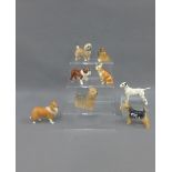 Collection of eight Beswick pottery dog figures to include a Dalmation, Lakeland Terrier and a