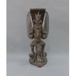 Indonesian carved wooden figure of Vishnu, 42cm high