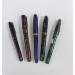 Vintage fountain pens with 14ct gold nibs to include a Swan Mabie Todd red marbled pen, Waterman