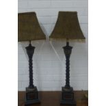 A pair of palm style table lamp bases with leopard print tasselled shades, 60cm tall to fitting (2)