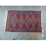 Eastern rug, red field, 132 x 78cm