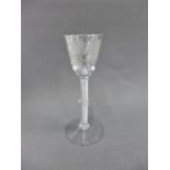 An 18th century Jacobite glass, with rose and thistle above a multi air twist stem, (chip to