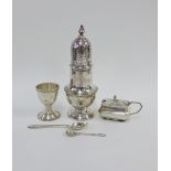 Edwardian silver sugar castor, London 1902, George V silver egg cup and spoon, and a silver