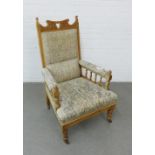 Early 20th century armchair with an upholstered back, arms and seat, on castors, 70 x 110cm
