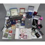 A large collection of costume jewellery to include brooches, necklaces, etc, together some silver