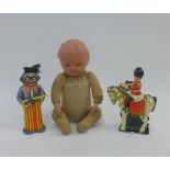 Two clockwork tinplate toys to include a drummer on horseback and a clown, together with an early