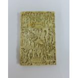 A late 19th / early 20th century Canton ivory visiting card case, profusely carved with a busy