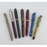 A collection of vintage fountain pens to include Parker, etc, some with 14k gold nibs (7)