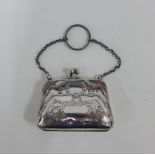 George VI silver purse with foliate and laurel leaf pattern, vacant cartouche and brown leather