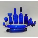 Collection of Bristol blue coloured glass wares to include bottles, rolling pins, glasses, etc (12)