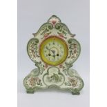 Green glazed pottery mantle clock, circular enamelled dial with Arabic numerals, height overall 36cm