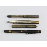 Curzons 9ct gold mounted fountain pen, an early 20th century silver mounted fountain pen and two