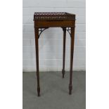 Mahogany table / stand, the square top with a fretwork gallery and a small pull out slide, raised on