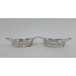 A pair of Victorian silver pierced oval basket bonbon dishes, Sheffield 1894, 16cm long (2)