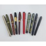 A collection of vintage fountain pens to include Golden Platignum, etc, some with 14k gold nibs (