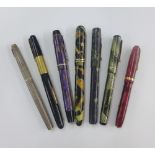 A collection of vintage fountain pens to include Waterman's and Parker, etc, some with 14k gold nibs