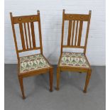 A pair of oak Arts & Crafts side chairs with upholstered seats and square tapering legs, 45 x