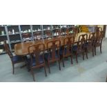 Mahogany triple pedestal dining table together with a set of nineteen Queen Anne style chairs to