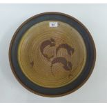 Studio pottery shallow bowl / charger, with a ribbed design, artist ,monogram JD to the base, 37cm