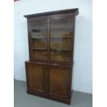 Georgian mahogany bookcase cabinet, with a cornice top over a pair of glazed doors with a shelved