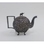 Eastern white metal teapot, the lid with an elephant finial, 12cm high