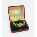 Early 20th century 9ct gold expanding bracelet, centred with a clover motif of three opals with a