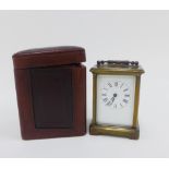 French brass and glass panelled carriage clock, with leather carry case, and key, 15cm high