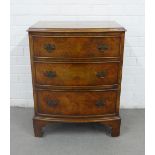 Walnut bow front chest of small proportions, with three long drawers and bracket feet, 57 x 71 x
