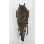 Mali circumcision mask with applied decorated brass sheet giving the appearance of a helmet, 37cm