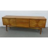 A.H McIntosh & Co, Ltd, Kirkcaldy, mid century 'Sunburst' teak sideboard, with three central