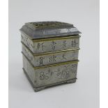 Chinese pewter incense clock, with pierced brass cover over three square sections with incised