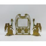 French brass 'Metropolitan' arched frame, 32cm, and a pair of brass Angle candlesticks, 93)